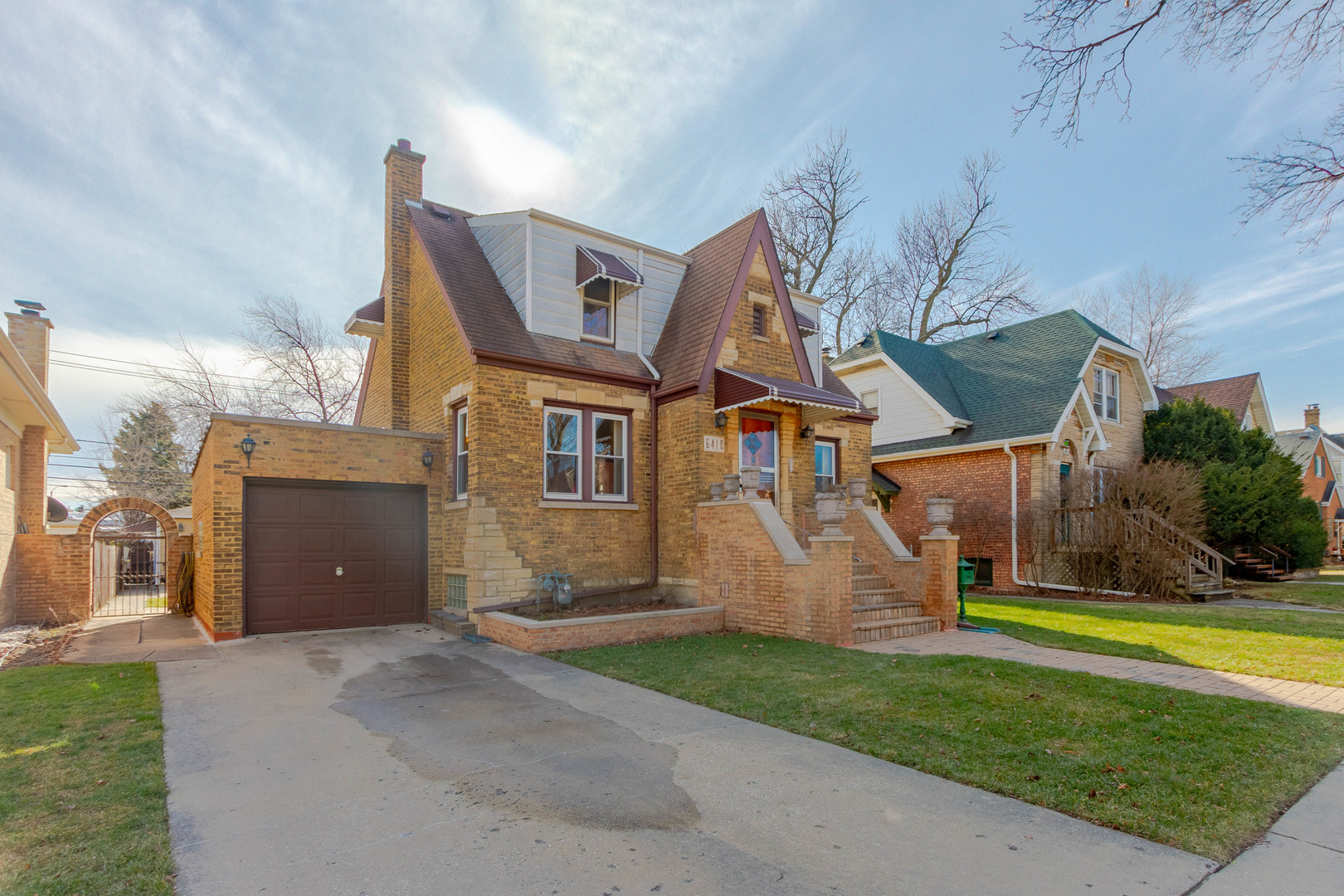 6410 Sinclair Avenue Berwyn, IL 60402 - Photo 2 of 31 a front view of a house with a yard and garage