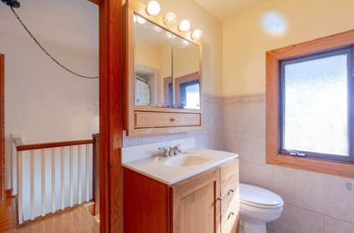 6410 Sinclair Avenue Berwyn, IL 60402 - Photo 23 of 31 a bathroom with a sink and a toilet