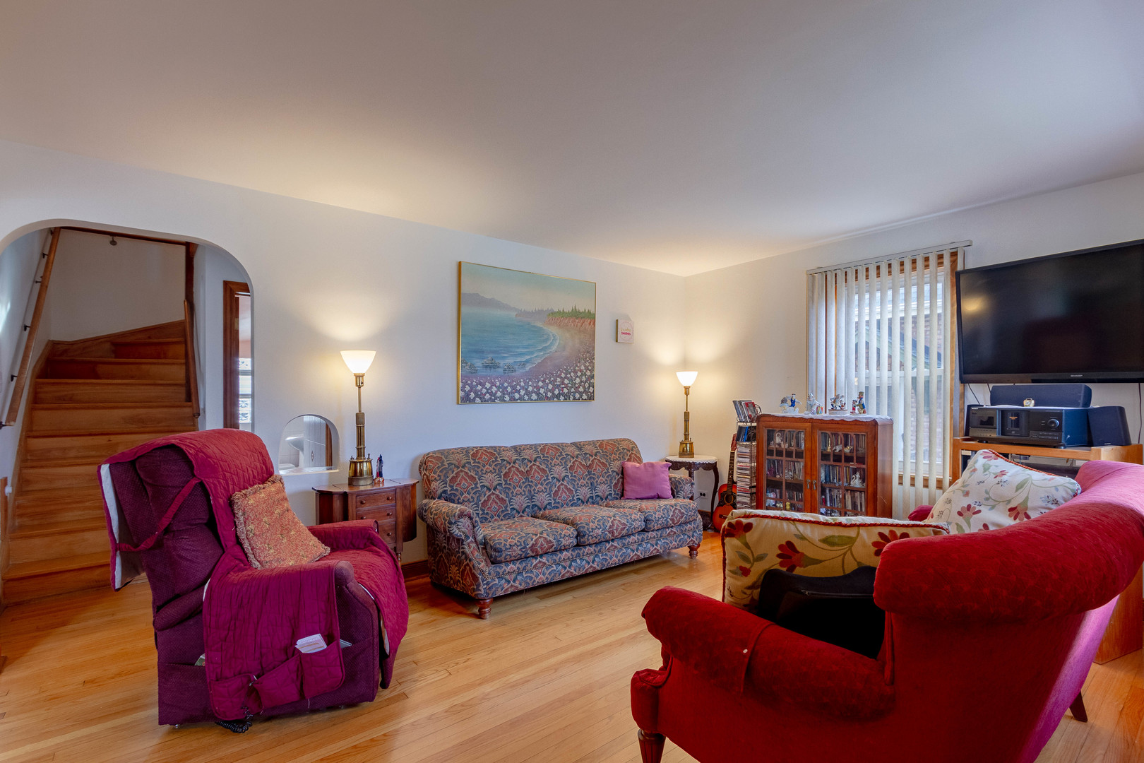 6410 Sinclair Avenue Berwyn, IL 60402 - Photo 7 of 31 a living room with furniture and a flat screen tv