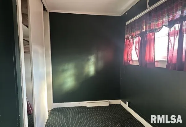 a view of an empty room and window