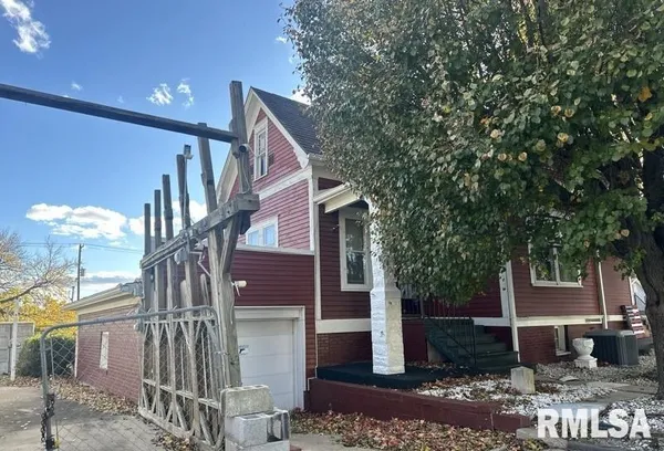 a view of a house with brick walls