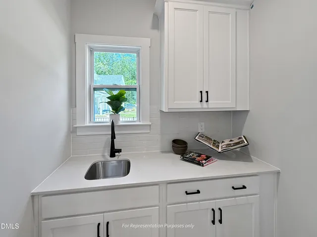 a living room with furniture fireplace and a lamp