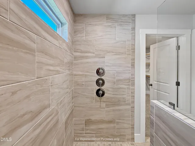 a view of an empty room and closet area