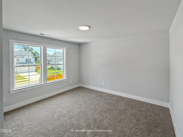 a view of a livingroom with furniture and front door