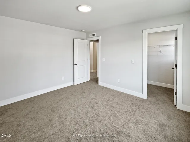 a view of a sign board with flower garden