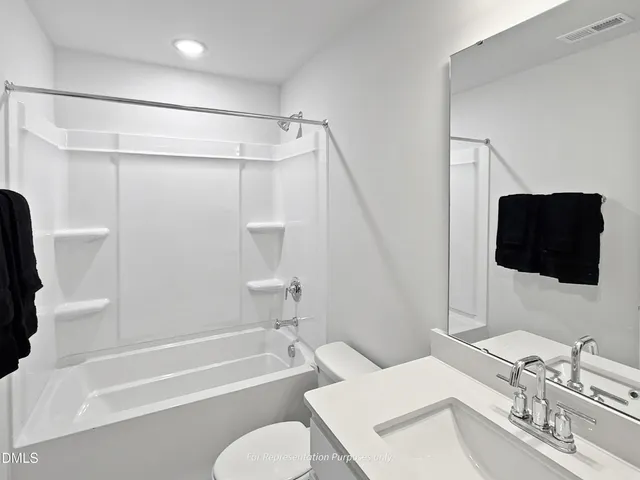 a view of a lake with sitting area