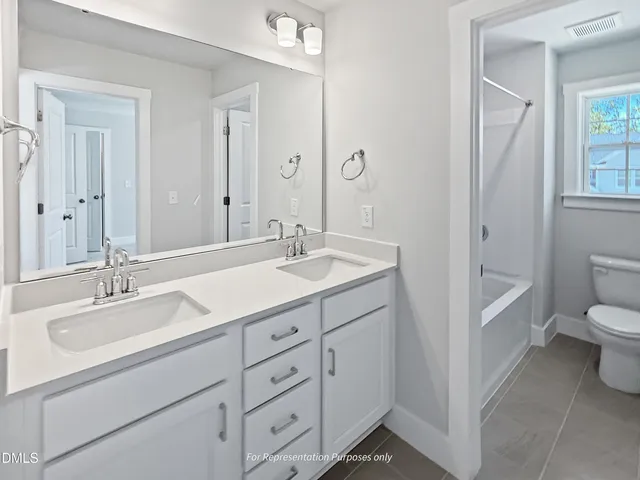 a view of a patio with table and chairs potted plants