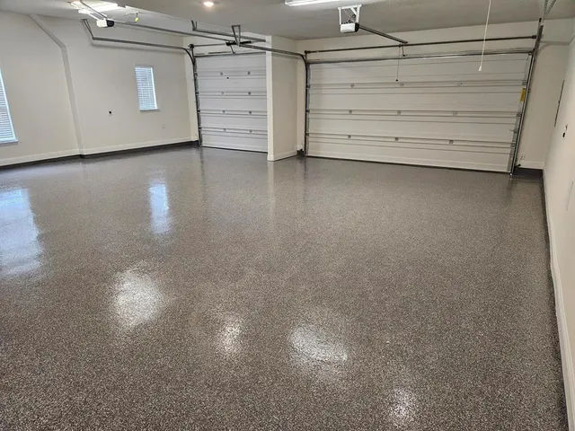 a view of a livingroom with wooden floor and a window