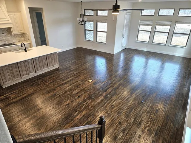 a view of an entryway with wooden floor