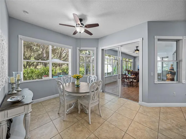 a dining room with furniture and window