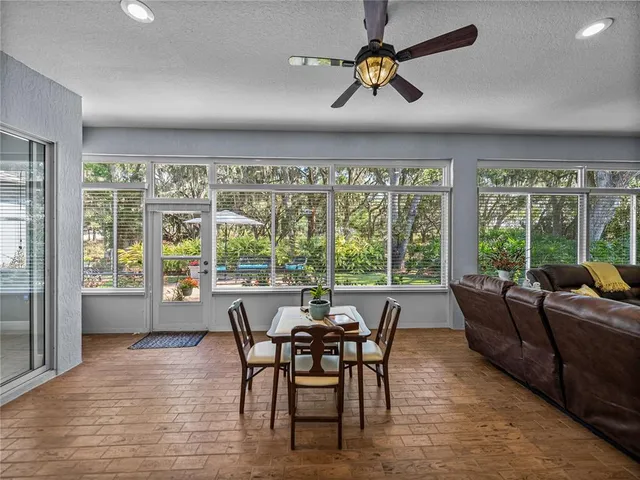a view of a dining room with furniture window and outside view