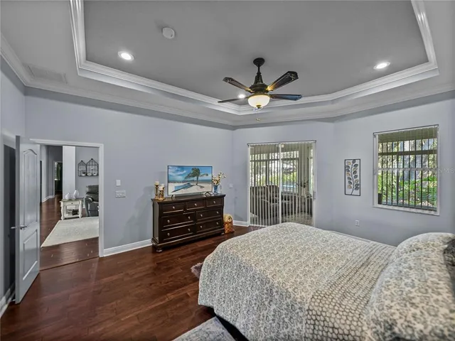 a bedroom with a bed dresser and a window