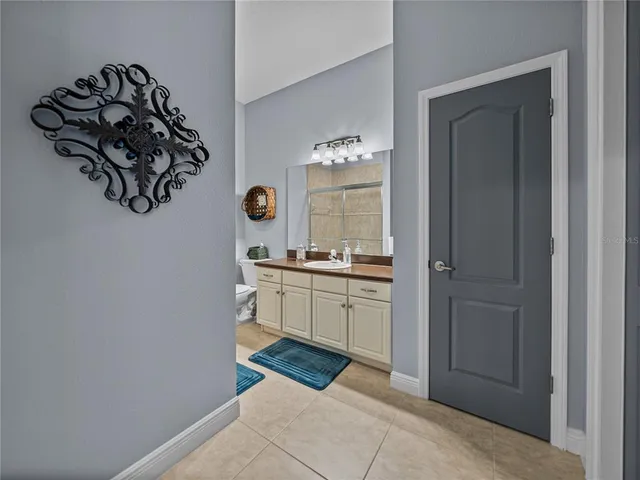 a room with a sink and a mirror