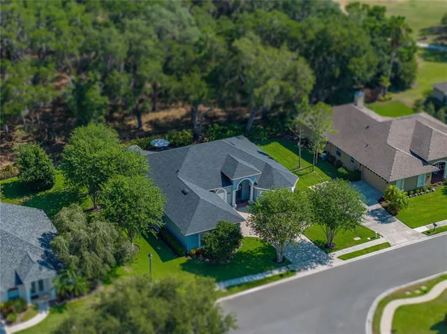 an aerial view of a house with a garden