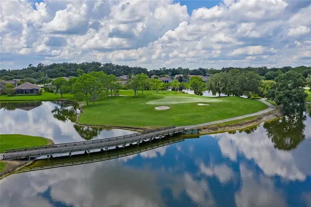 a view of a golf course with a lake view