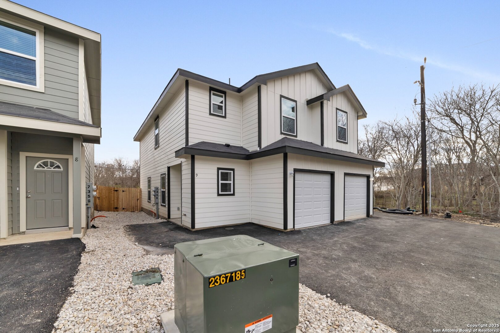 8711 Key Windy Way, Unit 2 Converse, TX 78109 - Photo 2 of 22 a view of a white house with a large tree