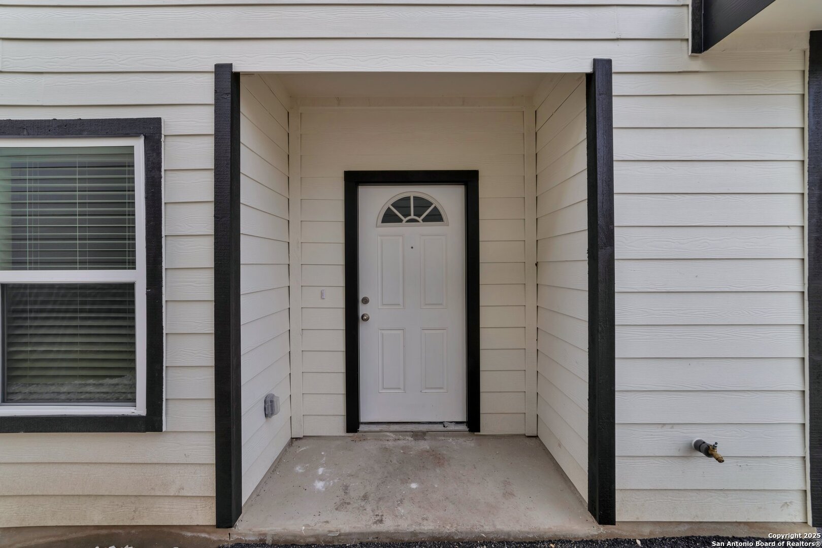 8711 Key Windy Way, Unit 2 Converse, TX 78109 - Photo 4 of 22 a view of a door and a window
