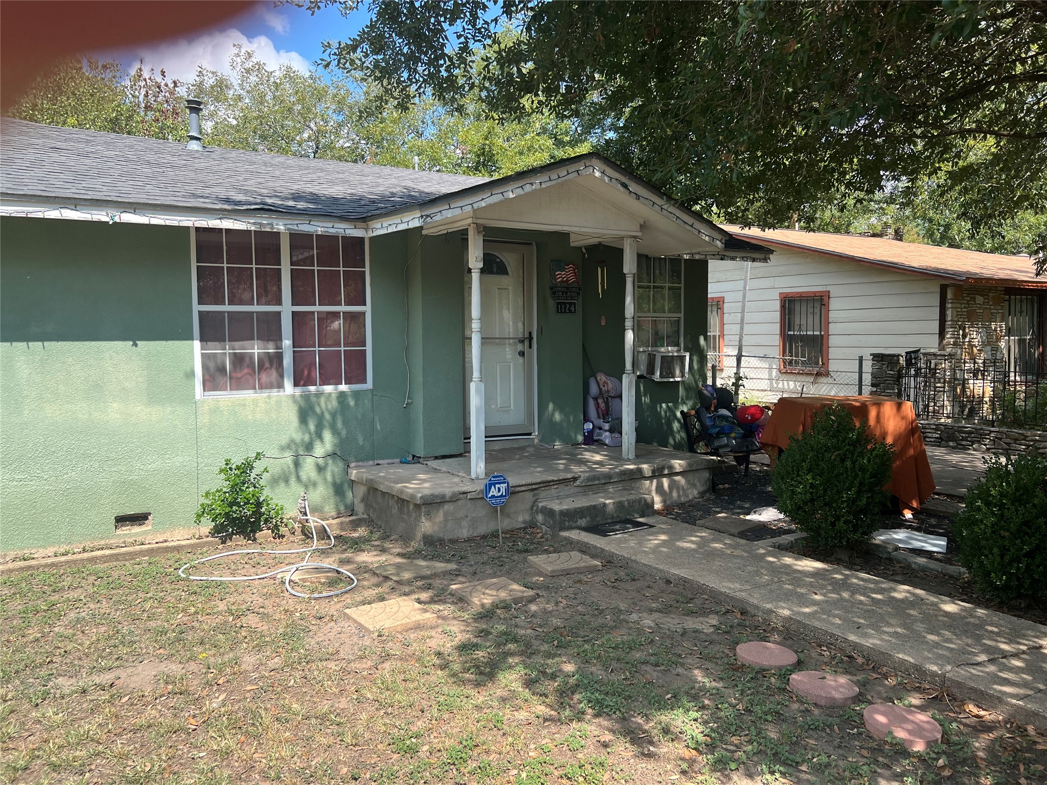 1124 Spur Street Austin, TX 78721 - Photo 1 of 3 a front view of a house with garden