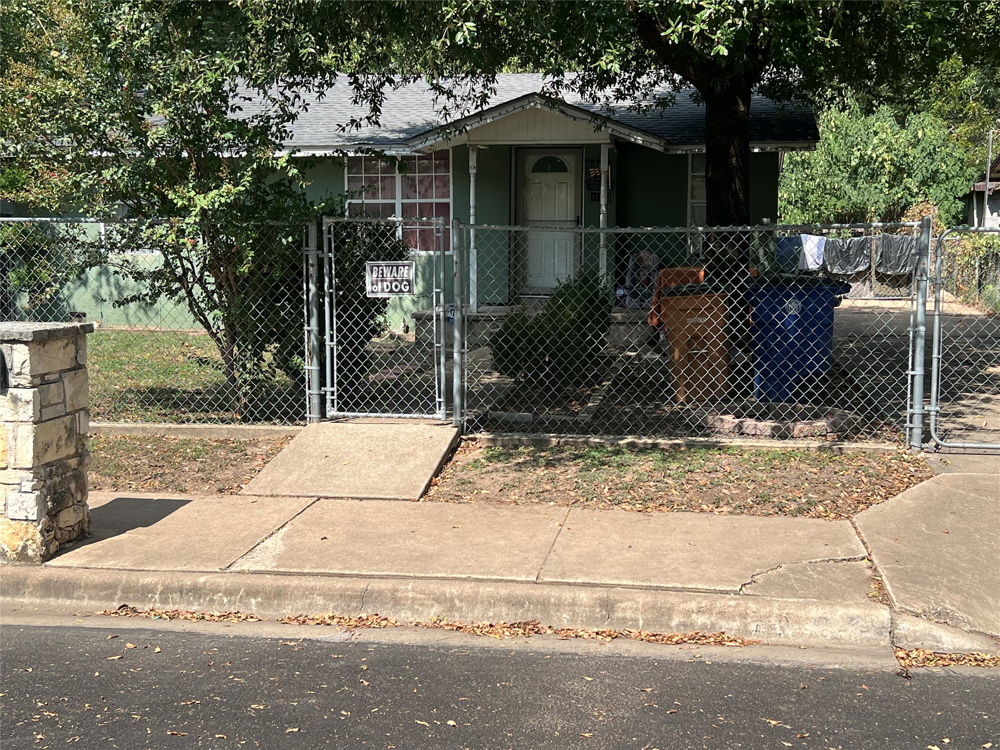 1124 Spur Street Austin, TX 78721 - Photo 3 of 3 a house with trees in front of it