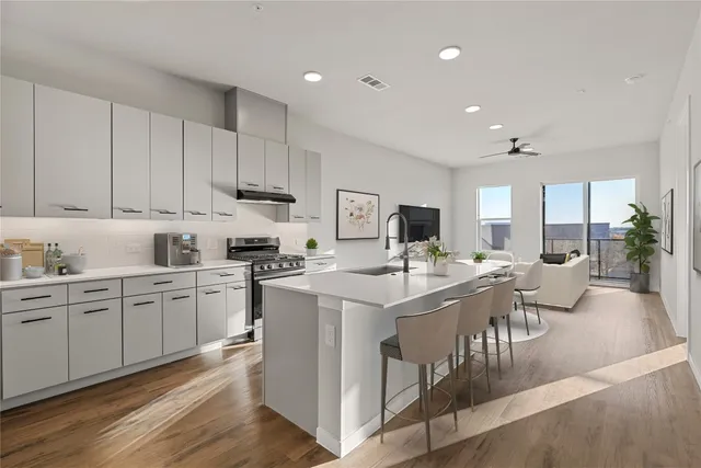 a kitchen with counter top space appliances and cabinets