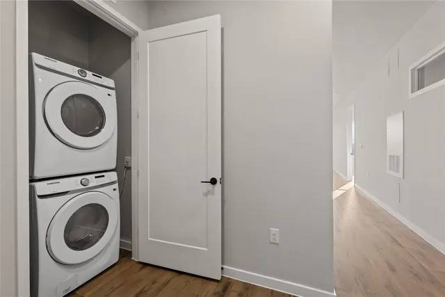 a view of a hallway with washer and dryer