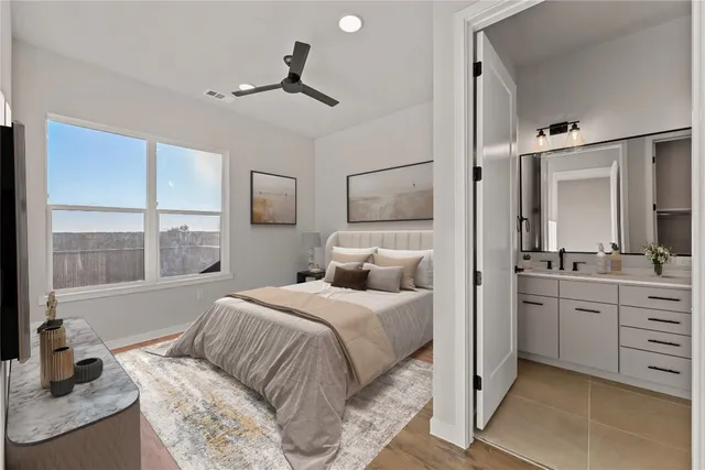 a bedroom with a bed and a large window