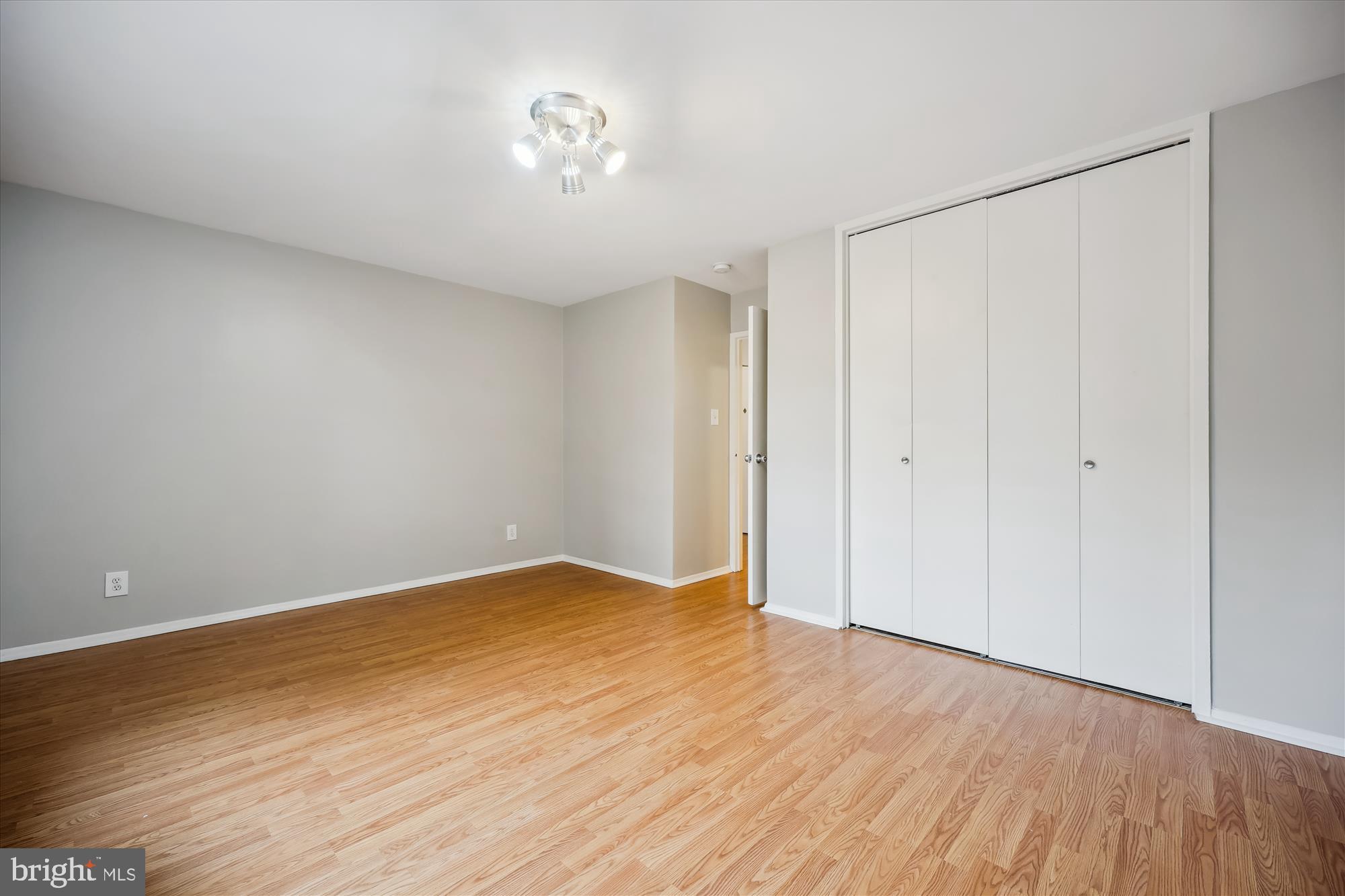 8601 Manchester Road, Unit 319 Silver Spring, MD 20901 - Photo 15 of 70 a view of an empty room with wooden floor