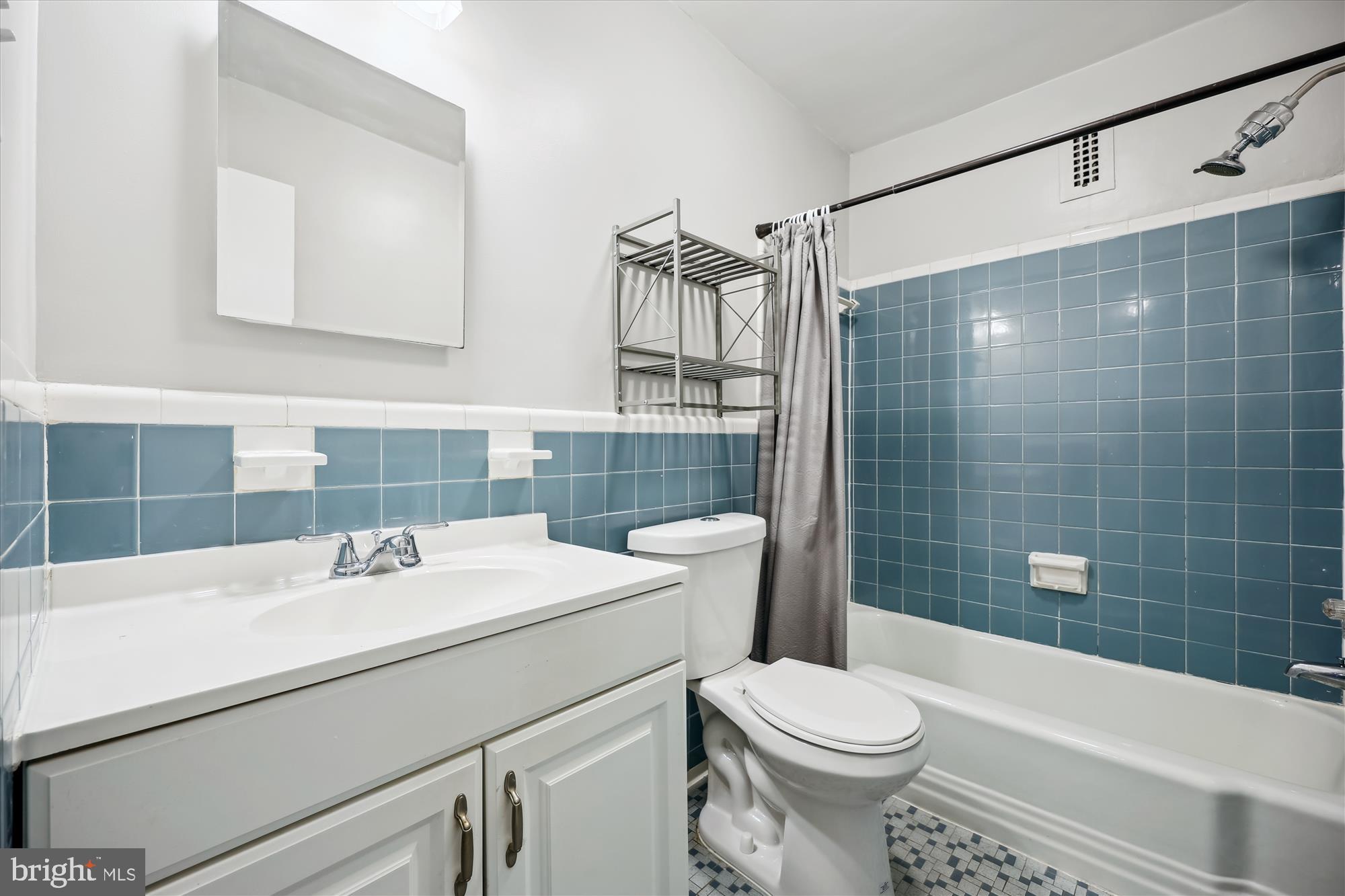 8601 Manchester Road, Unit 319 Silver Spring, MD 20901 - Photo 17 of 70 a bathroom with a sink toilet and shower