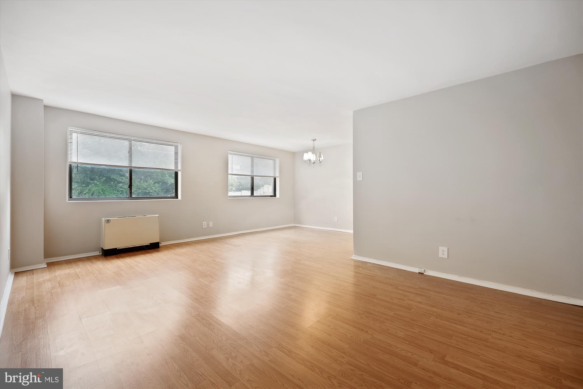 8601 Manchester Road, Unit 319 Silver Spring, MD 20901 - Photo 69 of 70 an empty room with wooden floor and windows