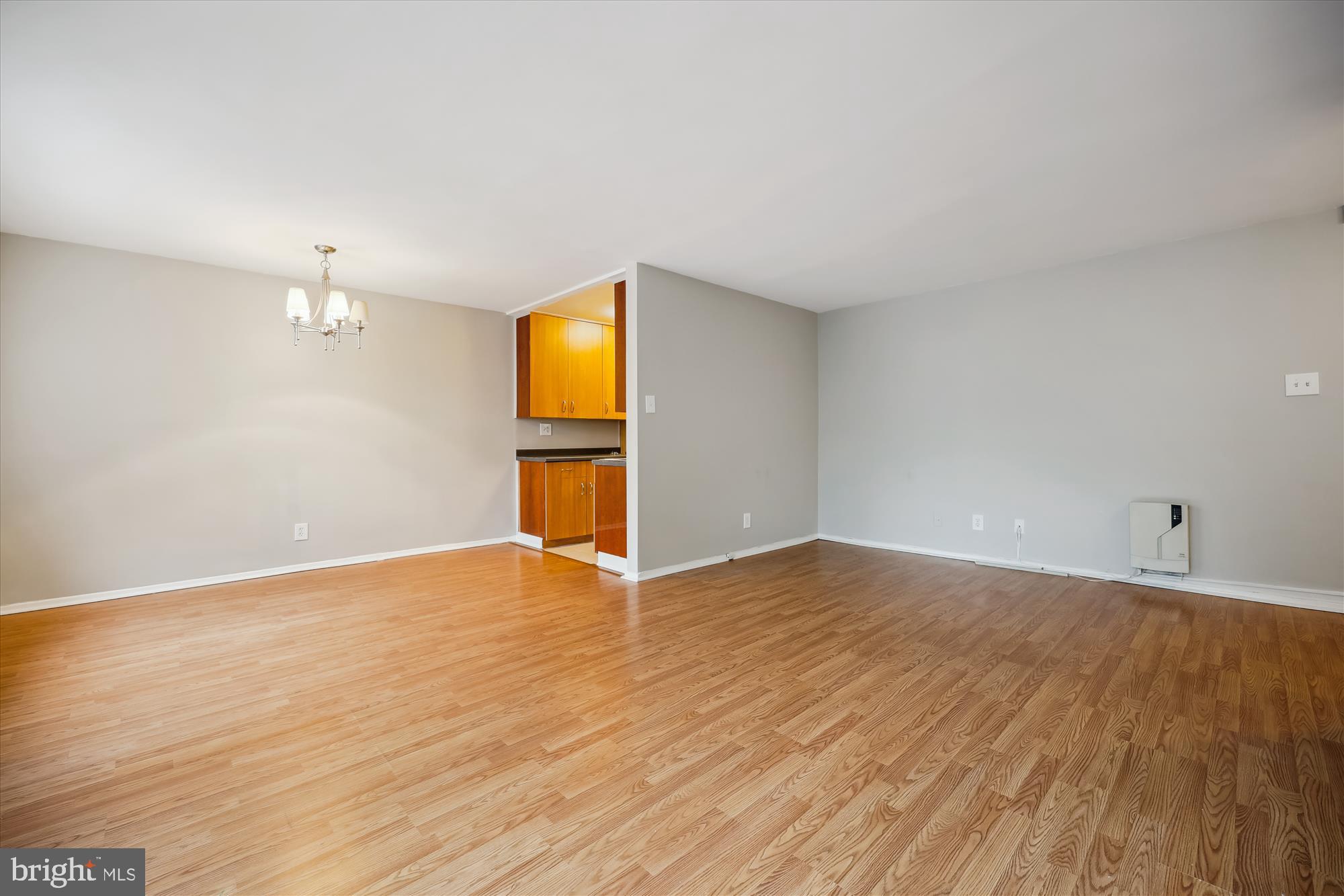 8601 Manchester Road, Unit 319 Silver Spring, MD 20901 - Photo 19 of 70 a view of empty room with wooden floor and fan