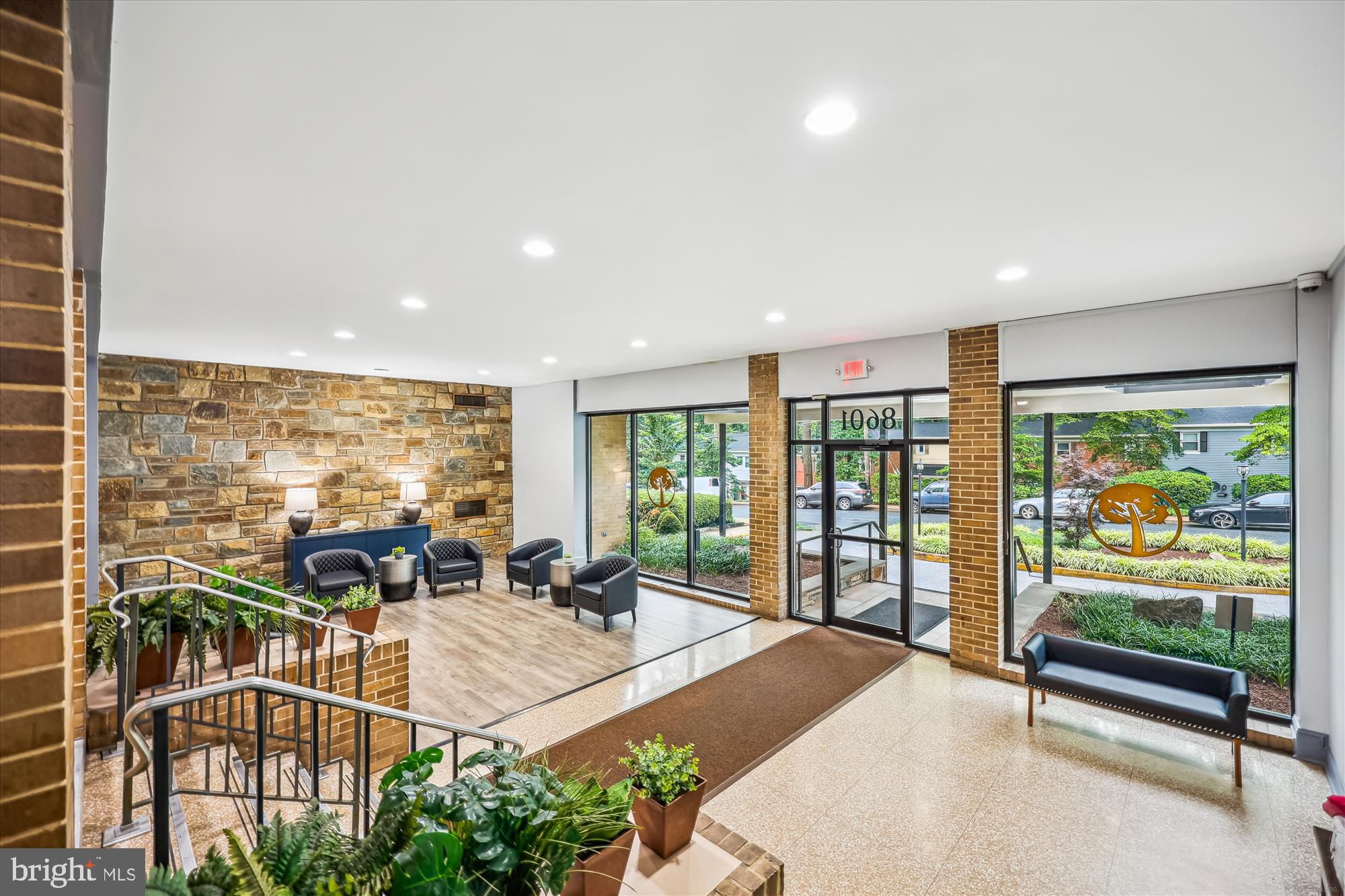 8601 Manchester Road, Unit 319 Silver Spring, MD 20901 - Photo 31 of 70 a living room with furniture tv and large windows