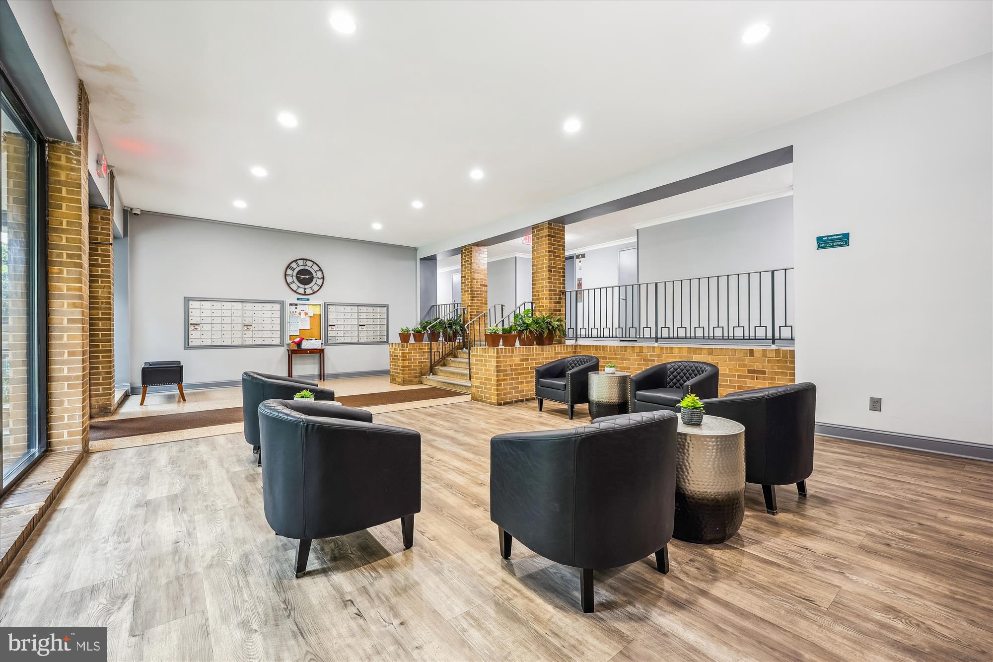 8601 Manchester Road, Unit 319 Silver Spring, MD 20901 - Photo 33 of 70 a living room with a couch and a table