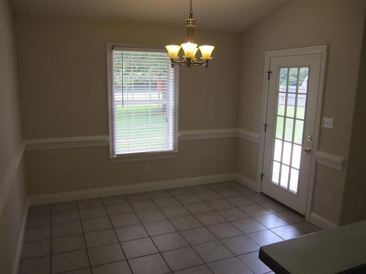5322 Morgan Ridge Drive Milton, FL 32570 - Photo 15 of 50 wide chair rail & access to the covered patio.