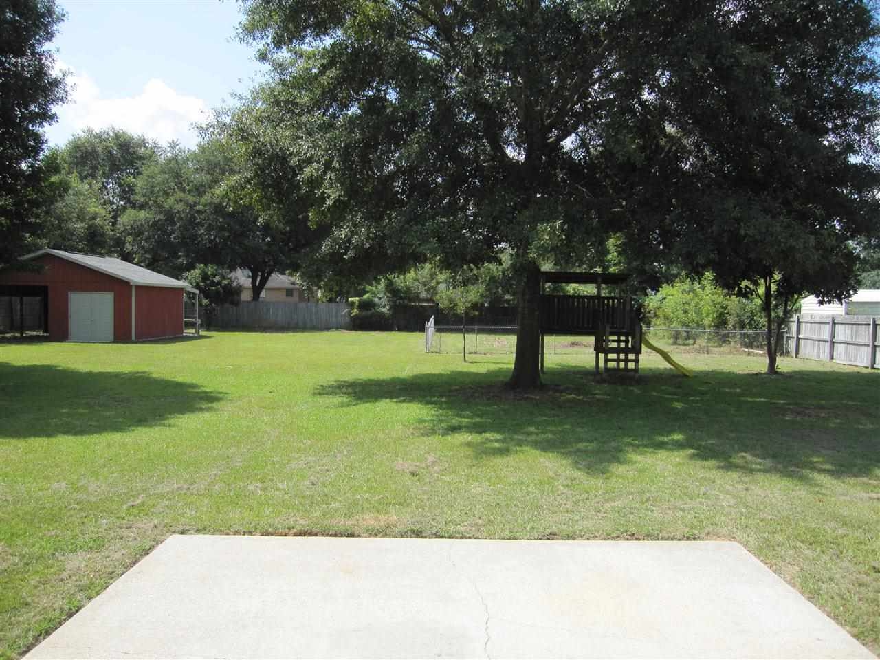 5322 Morgan Ridge Drive Milton, FL 32570 - Photo 33 of 50 open patio. Mature oaks provide wonderful shade!