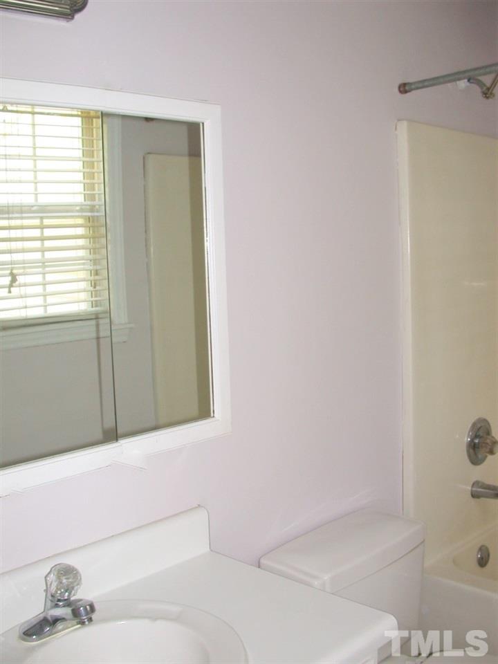 2124 Ruddy Road Raleigh, NC 27616 - Photo 13 of 20 a bathroom with a bathtub and a shower