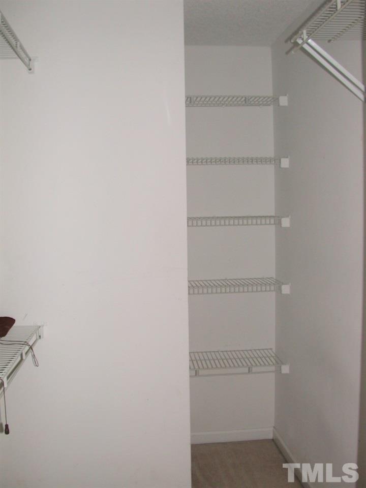 2124 Ruddy Road Raleigh, NC 27616 - Photo 14 of 20 a view of a room with racks on the wall