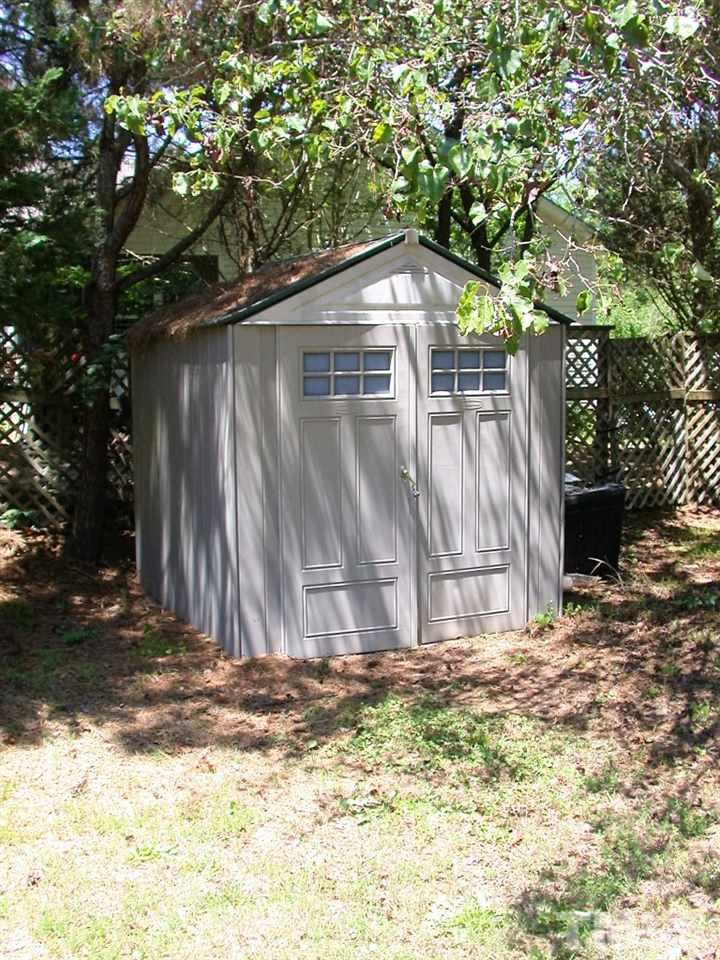 2124 Ruddy Road Raleigh, NC 27616 - Photo 19 of 20 a backyard of a house with large trees