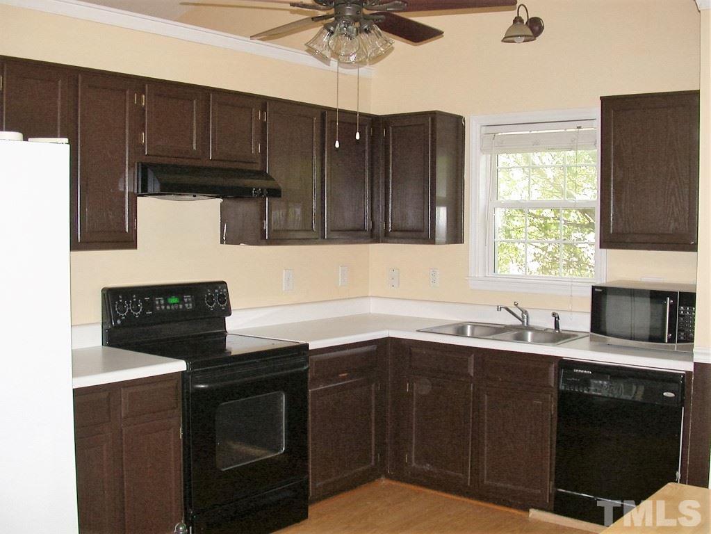 2124 Ruddy Road Raleigh, NC 27616 - Photo 4 of 20 a kitchen with stainless steel appliances a stove sink microwave and cabinets