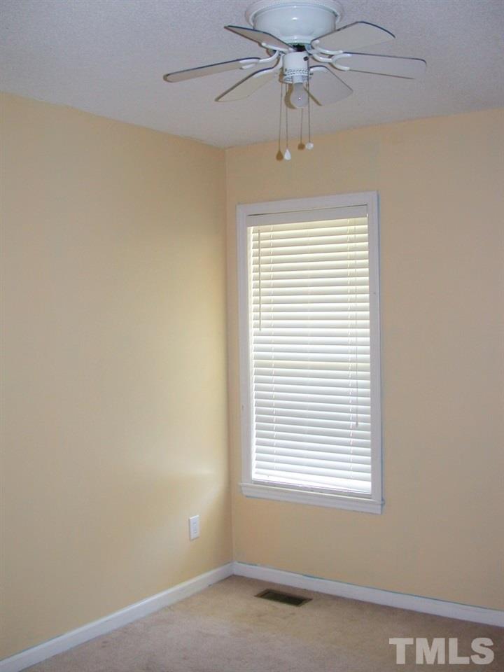 2124 Ruddy Road Raleigh, NC 27616 - Photo 8 of 20 an empty room with a window