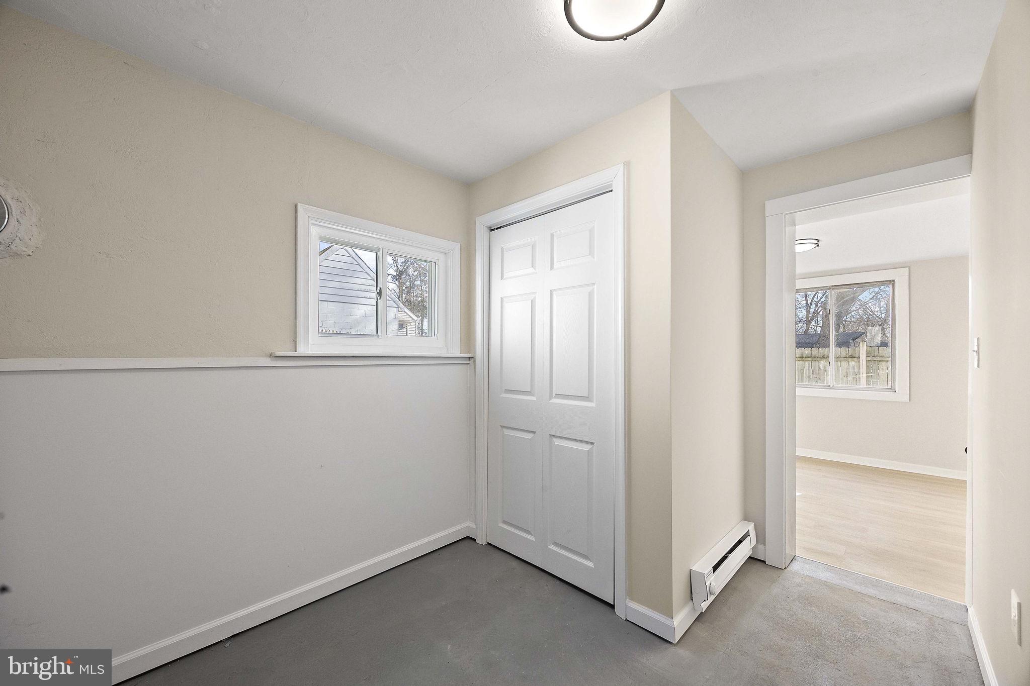 2109 Ferncroft Avenue Upper Chichester, PA 19061 - Photo 19 of 25 an empty room with windows