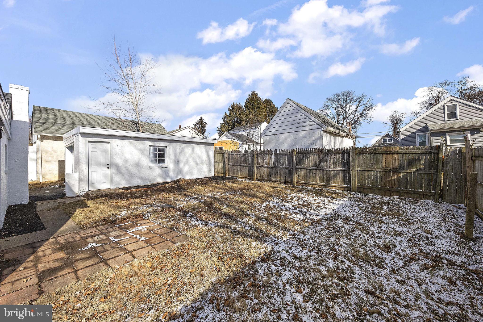 2109 Ferncroft Avenue Upper Chichester, PA 19061 - Photo 20 of 25 a view of a white house with a yard