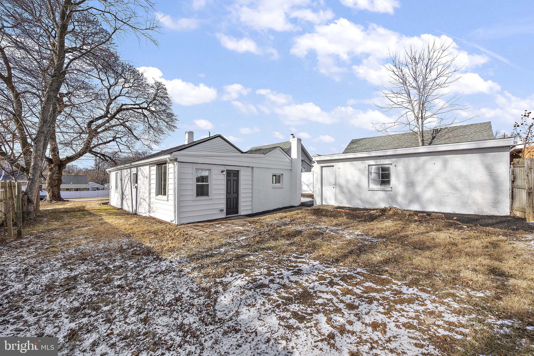 2109 Ferncroft Avenue Upper Chichester, PA 19061 - Photo 21 of 25 a view of a yard in front of a house with a large tree