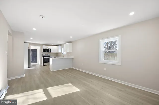 a view of kitchen with wooden floor