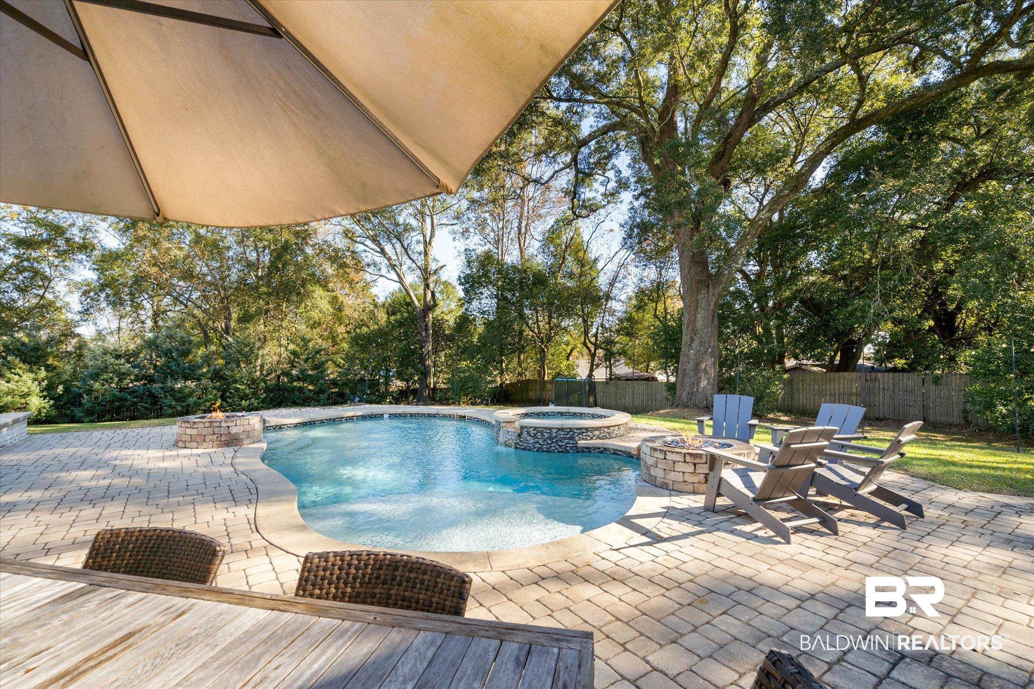 3713 Old Shell Road Mobile, AL 36608 - Photo 40 of 52 View of swimming pool with a fire pit, an in ground hot tub, and a patio