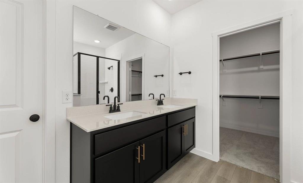 908 Colgate Circle Princeton, TX 75407 - Photo 9 of 14 Primary Bathroom Representative Photo featuring the Noir Collection