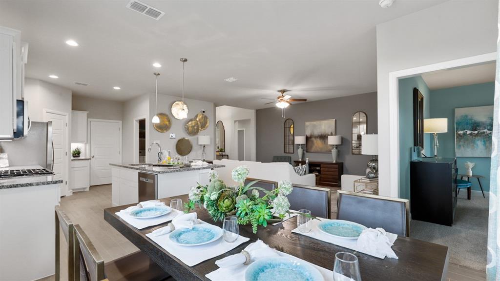 717 Bushman Drive Aledo, TX 76008 - Photo 9 of 40 a very nice looking kitchen with a table and chairs