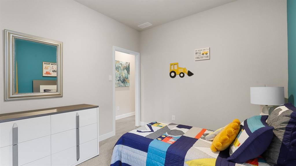 717 Bushman Drive Aledo, TX 76008 - Photo 27 of 40 a bedroom with a bed and a window