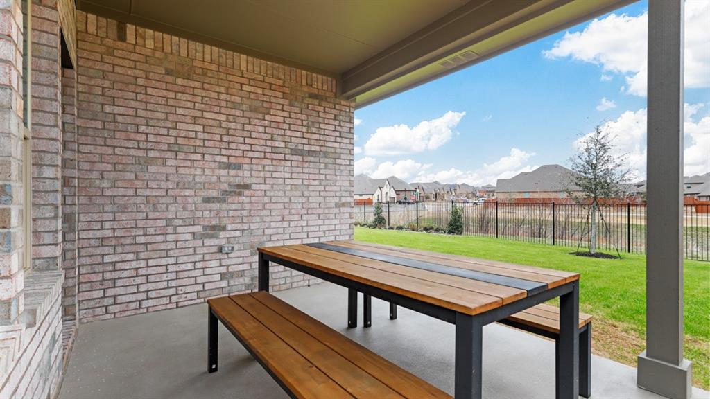 717 Bushman Drive Aledo, TX 76008 - Photo 31 of 40 a view of a patio with a table and chairs