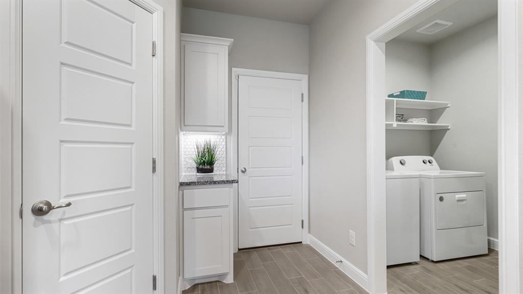 717 Bushman Drive Aledo, TX 76008 - Photo 2 of 40 a view of washer and dryer