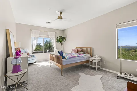 a bedroom with furniture and a window